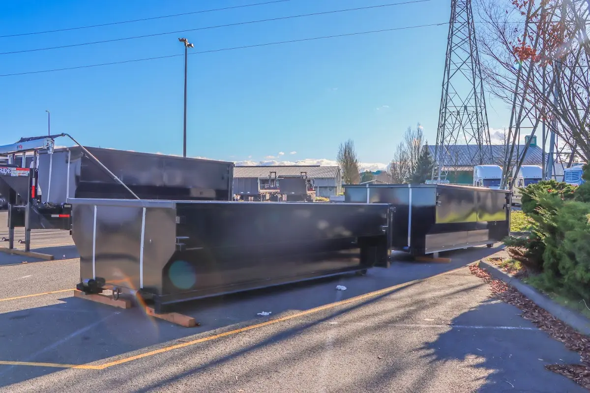 Roll-off dumpster ready for waste disposal at job site for Construction Dumpster Rental in Olive